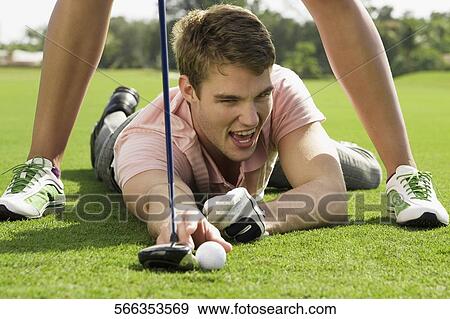 Couple playing golf in a golf course, Biltmore Golf Course, Coral Gables, Florida, USA View Large Photo Image Stock Photo - Couple playing golf in a golf course, Biltmore Golf Course, Coral Gables, Florida, USA. Fotosearch