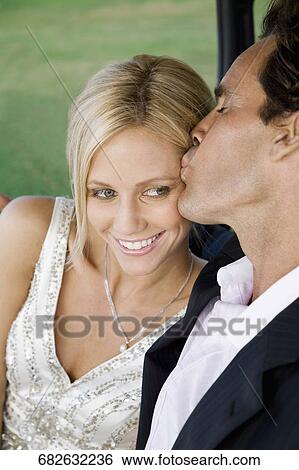 Couple romancing in a golf cart and smiling, Biltmore Golf Course, Coral Gables, Florida, USA View Large Photo Image Stock Photograph - Couple romancing in a golf cart and smiling, Biltmore Golf Course, Coral Gables, Florida, USA. Fotosearch