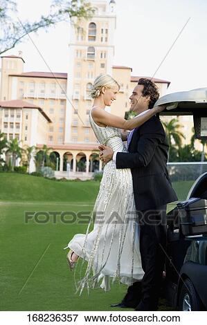 Couple romancing in a golf course and smiling, Biltmore Golf Course, Biltmore Hotel, Coral Gables, Florida, USA View Large Photo Image Stock Photo - Couple romancing in a golf course and smiling, Biltmore Golf Course, Biltmore Hotel, Coral Gables, Florida, USA. Fotosearch