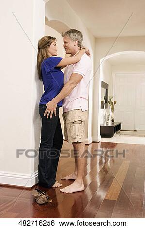 Couple romancing in the house View Large Photo Image Stock Photograph - Couple romancing in the house. Fotosearch