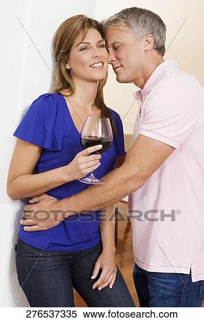 Stock Photography - Couple romancing in the house. Fotosearch