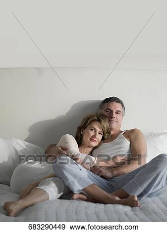 Couple romancing on the bed View Large Photo Image Stock Photo - Couple romancing on the bed. Fotosearch
