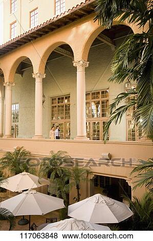 Stock Photo - Couple walking in the balcony, Biltmore Hotel, Coral Gables, Florida, USA. Fotosearch