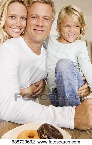 Couple with their daughter smiling View Large Photo Image Stock Image - Couple with their daughter smiling. Fotosearch