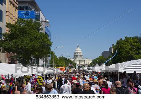 Crowd in a gay pride parade with a government building in the background, Capitol Building, Washington DC, USA View Large Photo Image Stock Image - Crowd in a gay pride parade with a government building in the background, Capitol Building, Washington DC, USA. Fotosearch