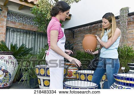 Customer buying decorative urns View Large Photo Image Picture - Customer buying decorative urns. Fotosearch