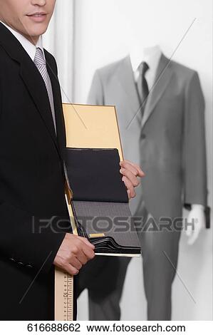 Customer holding fabric swatches in a clothing store View Large Photo Image Stock Image - Customer holding fabric swatches in a clothing store. Fotosearch