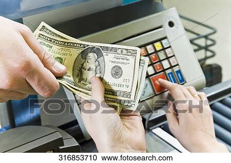 Customer paying to cashier View Large Photo Image Stock Image - Customer paying to cashier. Fotosearch