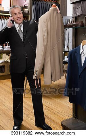 Customer shopping in a clothing store View Large Photo Image Stock Image - Customer shopping in a clothing store. Fotosearch