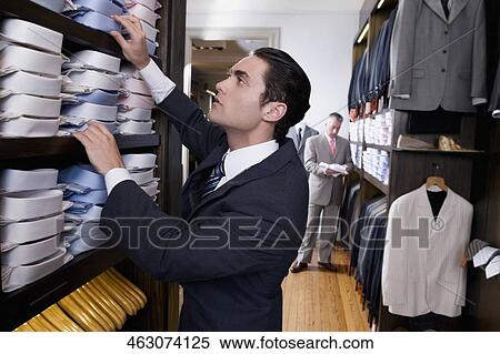 Customers shopping in a clothing store View Large Photo Image Stock Photography - Customers shopping in a clothing store. Fotosearch