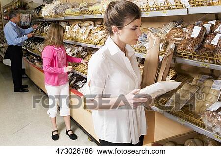 Customers shopping in a supermarket View Large Photo Image Stock Photograph - Customers shopping in a supermarket. Fotosearch