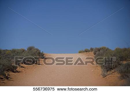 Dirt road passing through a desert, Horseshoe Bend, Page, Arizona, USA View Large Photo Image Stock Photography - Dirt road passing through a desert, Horseshoe Bend, Page, Arizona, USA. Fotosearch
