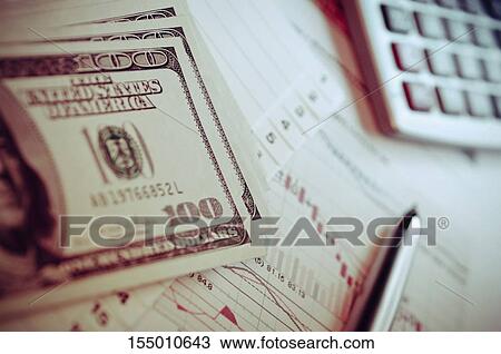 Stock Image - Dollar and pen on the chart. Fotosearch