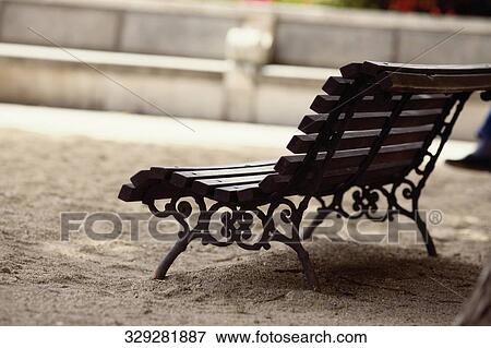 Empty bench in a park, Madrid, Spain View Large Photo Image Stock Photo - Empty bench in a park, Madrid, Spain. Fotosearch