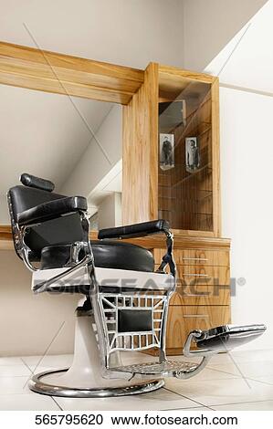 Stock Image - Empty chair in a salon. Fotosearch