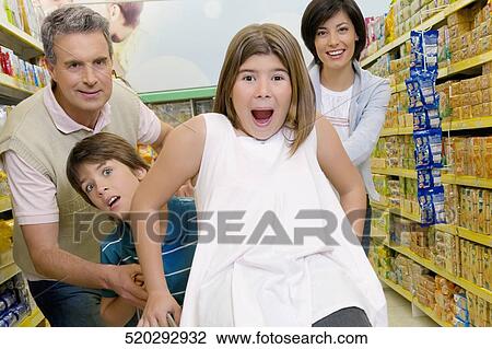 Family enjoying in a supermarket View Large Photo Image Stock Image - Family enjoying in a supermarket. Fotosearch