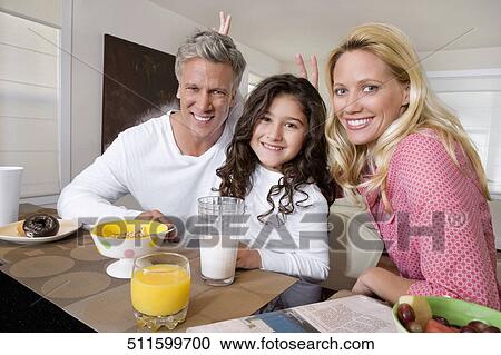 Family having breakfast View Large Photo Image Stock Image - Family having breakfast. Fotosearch