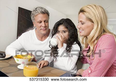 Family having breakfast View Large Photo Image Stock Image - Family having breakfast. Fotosearch