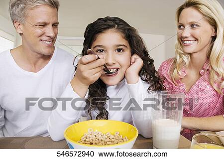 Family having breakfast View Large Photo Image Stock Image - Family having breakfast. Fotosearch