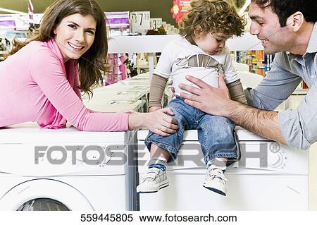 Stock Photography - Family in a supermarket. Fotosearch