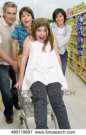 Family shopping in a supermarket View Large Photo Image Stock Photo - Family shopping in a supermarket. Fotosearch