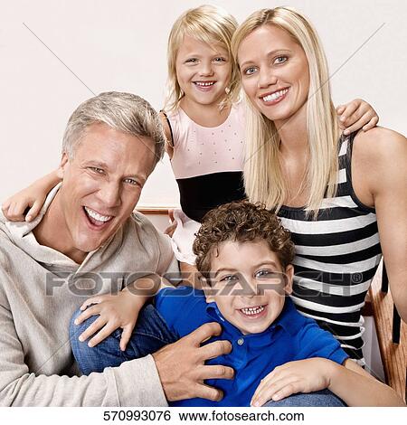 Family sitting on a staircase View Large Photo Image Stock Photograph - Family sitting on a staircase. Fotosearch