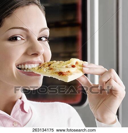 Female chef eating a slice of pizza View Large Photo Image Stock Photography - Female chef eating a slice of pizza. Fotosearch