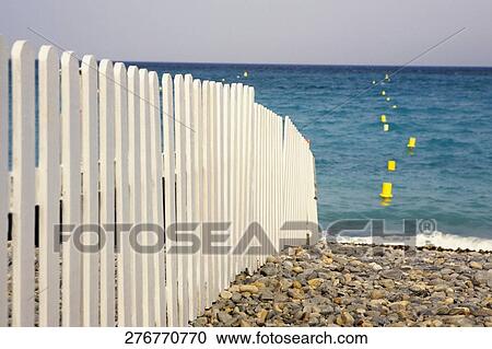 Fence on the beach View Large Photo Image Stock Image - Fence on the beach. Fotosearch