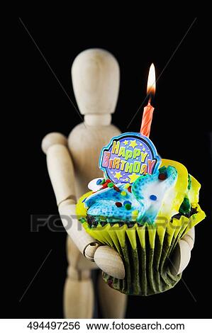 Figurine carrying a birthday cake View Large Photo Image Stock Photograph - Figurine carrying a birthday cake. Fotosearch