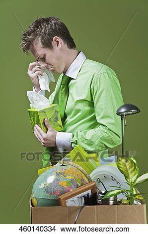 Picture - Fired businessman wiping his tears. Fotosearch