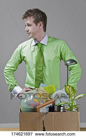 Fired businessman with his office belongings View Large Photo Image Stock Photo - Fired businessman with his office belongings. Fotosearch