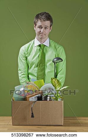 Stock Photo - Fired businessman with his office belongings. Fotosearch