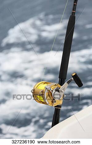 Fishing reel on a boat View Large Photo Image Stock Image - Fishing reel on a boat. Fotosearch