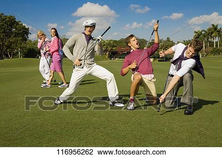 Five friends having fun in a golf course, Biltmore Golf Course, Coral Gables, Florida, USA View Large Photo Image Stock Image - Five friends having fun in a golf course, Biltmore Golf Course, Coral Gables, Florida, USA. Fotosearch
