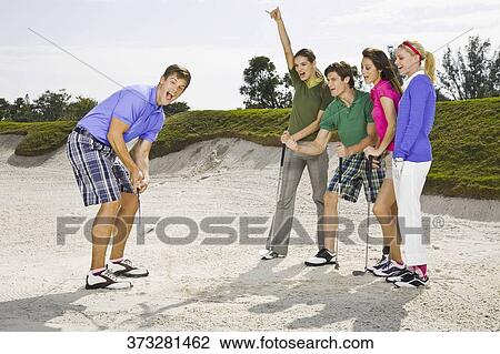 Five friends having fun in a golf course, Biltmore Golf Course, Coral Gables, Florida, USA View Large Photo Image Stock Image - Five friends having fun in a golf course, Biltmore Golf Course, Coral Gables, Florida, USA. Fotosearch