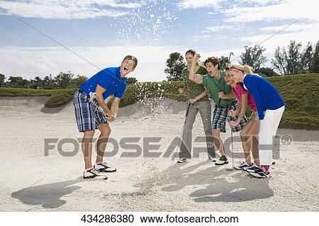 Five friends having fun in a golf course, Biltmore Golf Course, Coral Gables, Florida, USA View Large Photo Image Stock Image - Five friends having fun in a golf course, Biltmore Golf Course, Coral Gables, Florida, USA. Fotosearch