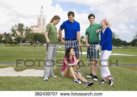 Five friends having fun in a golf course, Biltmore Hotel, Biltmore Golf Course, Coral Gables, Florida, USA View Large Photo Image Stock Photo - Five friends having fun in a golf course, Biltmore Hotel, Biltmore Golf Course, Coral Gables, Florida, USA. Fotosearch