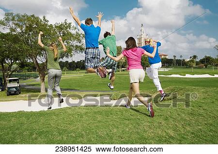 Five friends having fun in a golf course, Biltmore Golf Course, Coral Gables, Florida, USA View Large Photo Image Stock Photography - Five friends having fun in a golf course, Biltmore Golf Course, Coral Gables, Florida, USA. Fotosearch