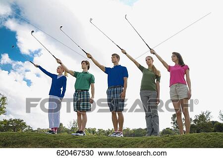 Five friends raising golf club in a golf course, Biltmore Golf Course, Coral Gables, Florida, USA View Large Photo Image Stock Image - Five friends raising golf club in a golf course, Biltmore Golf Course, Coral Gables, Florida, USA. Fotosearch