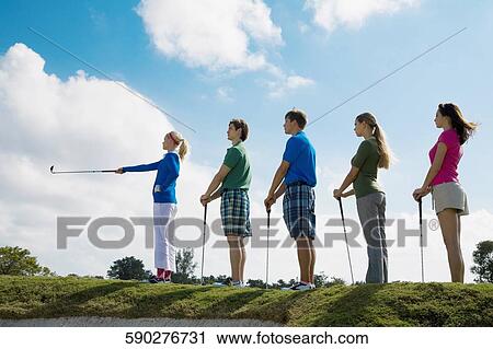 Five friends standing in a golf course, Biltmore Golf Course, Coral Gables, Florida, USA View Large Photo Image Stock Image - Five friends standing in a golf course, Biltmore Golf Course, Coral Gables, Florida, USA. Fotosearch