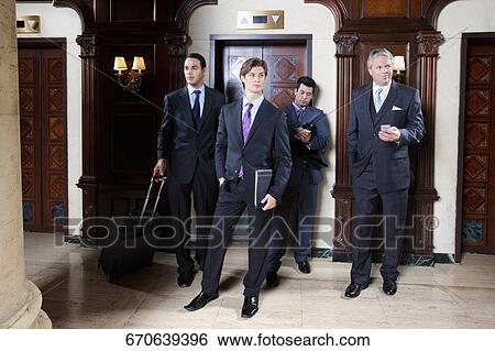 Four businessmen standing in a hotel lobby, Biltmore Hotel, Coral Gables, Florida, USA View Large Photo Image Stock Photograph - Four businessmen standing in a hotel lobby, Biltmore Hotel, Coral Gables, Florida, USA. Fotosearch