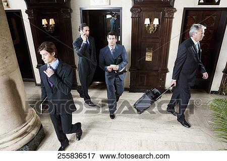 Four businessmen walking in a hotel lobby, Biltmore Hotel, Coral Gables, Florida, USA View Large Photo Image Stock Photo - Four businessmen walking in a hotel lobby, Biltmore Hotel, Coral Gables, Florida, USA. Fotosearch