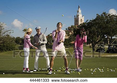 Four friends having fun in a golf course, Biltmore Golf Course, Coral Gables, Florida, USA View Large Photo Image Stock Image - Four friends having fun in a golf course, Biltmore Golf Course, Coral Gables, Florida, USA. Fotosearch