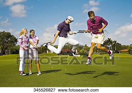 Four friends having fun in a golf course, Biltmore Golf Course, Coral Gables, Florida, USA View Large Photo Image Stock Photo - Four friends having fun in a golf course, Biltmore Golf Course, Coral Gables, Florida, USA. Fotosearch