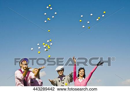 Four friends throwing golf balls in mid-air, Biltmore Golf Course, Coral Gables, Florida, USA View Large Photo Image Stock Image - Four friends throwing golf balls in mid-air, Biltmore Golf Course, Coral Gables, Florida, USA. Fotosearch