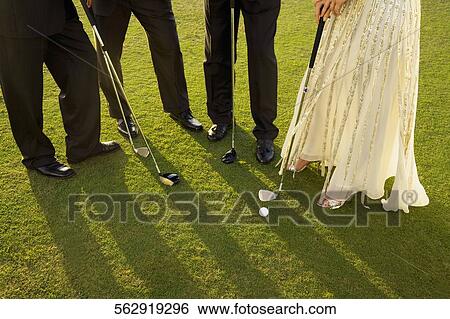 Stock Photograph - Four golfers playing golf in a golf course, Biltmore Golf Course, Coral Gables, Florida, USA. Fotosearch