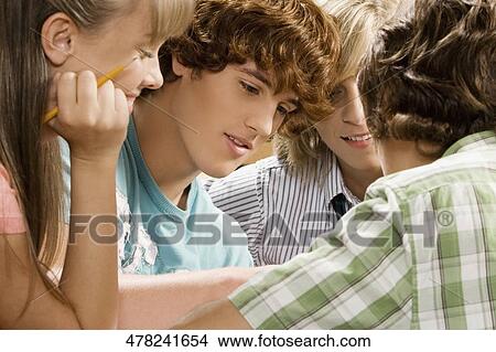 Four high school students studying View Large Photo Image Picture - Four high school students studying. Fotosearch