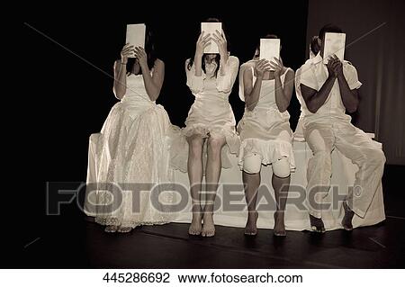 Four people hiding their faces with papers View Large Photo Image Stock Image - Four people hiding their faces with papers. Fotosearch