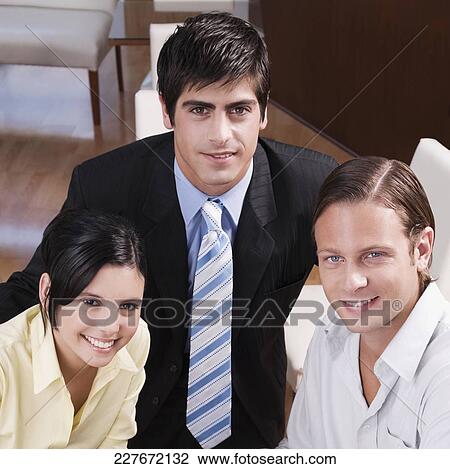Friends smiling in a restaurant View Large Photo Image Stock Image - Friends smiling in a restaurant. Fotosearch