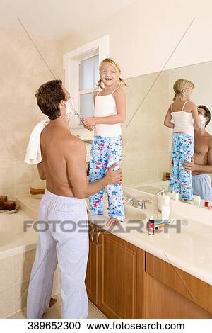 Girl playing with her father in the bathroom View Large Photo Image Stock Image - Girl playing with her father in the bathroom. Fotosearch